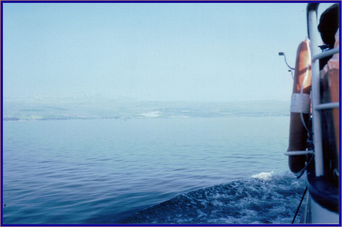 The Church of the Beatitudes in the distance from the Sea of Galilee